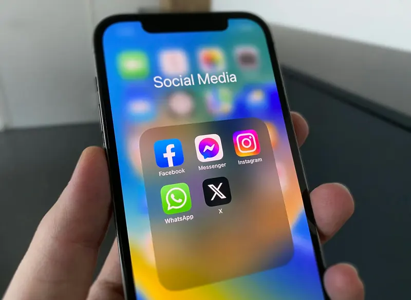 Phone showing social media apps used for book marketing